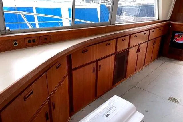 Slide: The Image of Interior of 1984 Bertram 54 Convertible yacht with wooden cabinets. - 10
