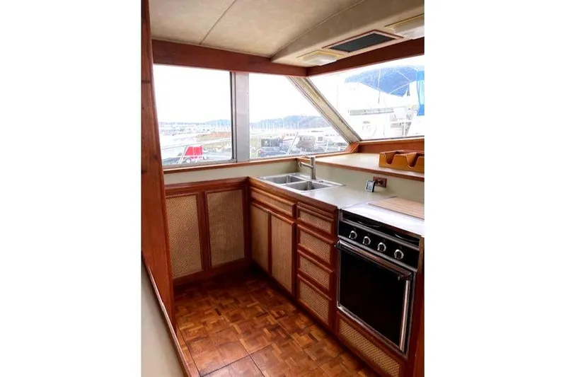 Slide: The Image of Kitchen on a 1984 Bertram 54 Convertible yacht. - 12