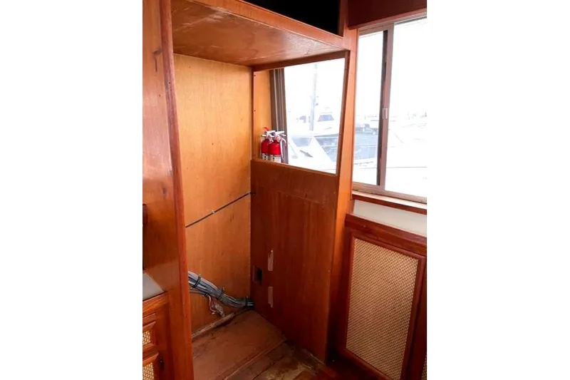 Slide: The Image of Interior of a 1984 Bertram 54 Convertible with wood paneling. - 16