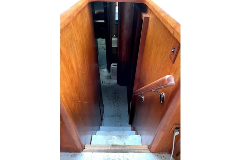 Slide: The Image of Staircase inside a 1984 Bertram 54 Convertible boat. - 19