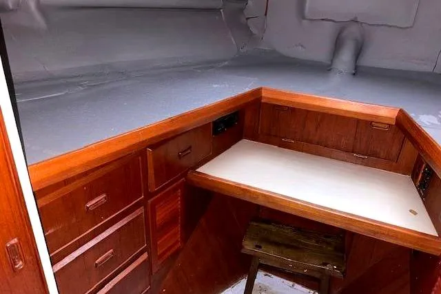 Slide: The Image of 1984 Bertram 54 Convertible interior with wooden cabinetry. - 23