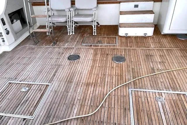 Slide: The Image of Teak deck of a 1984 Bertram 54 Convertible boat. - 3