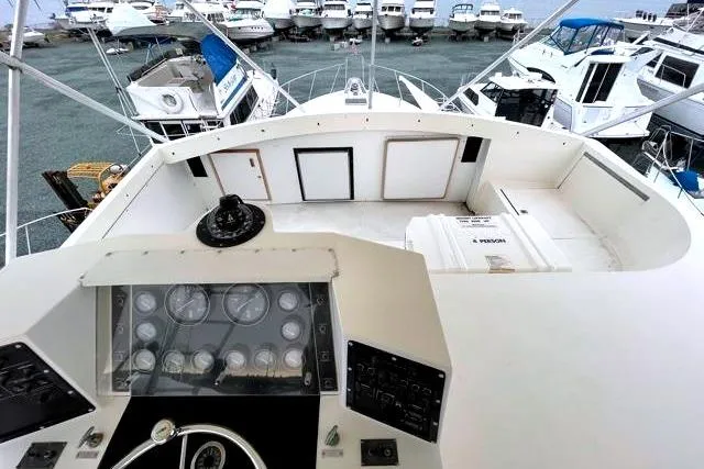 Slide: The Image of Cockpit of a 1984 Bertram 54 Convertible with instrument panel. - 32