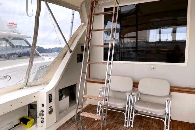 Slide: The Image of Interior of a 1984 Bertram 54 Convertible yacht with ladder and chairs. - 7