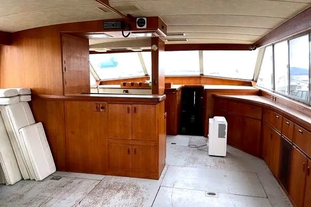Slide: The Image of Interior of a 1984 Bertram 54 Convertible yacht with wooden cabinetry. - 8