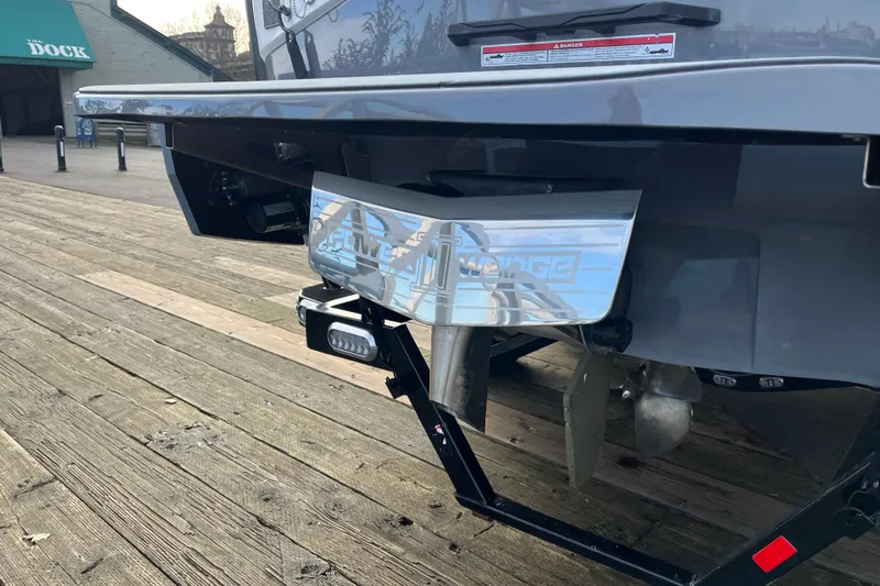 Slide: The Image of 2024 Axis T220 boat with power wedge, docked on wooden pier. - 20