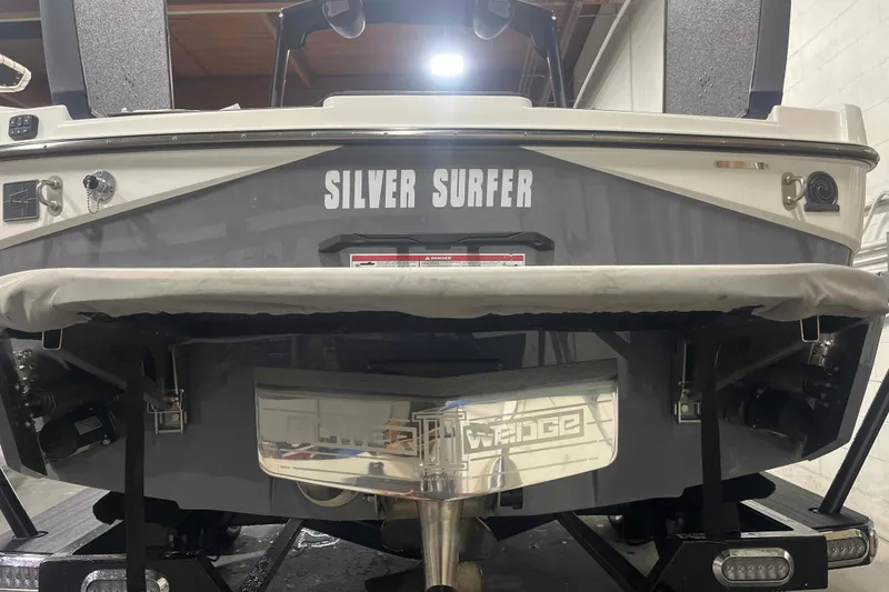 Slide: The Image of 2024 Axis T220 boat named "Silver Surfer" with Wedge feature, rear view. - 29