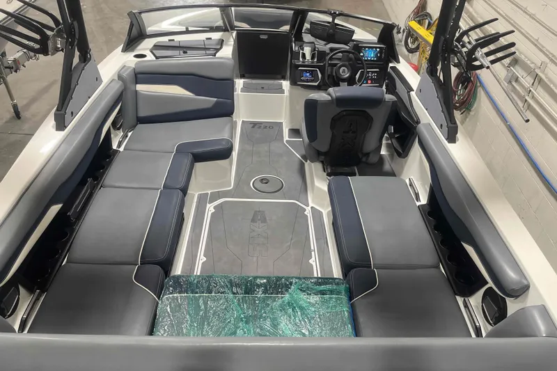 Slide: The Image of 2024 Axis T220 boat interior with sleek seating and modern dashboard design. - 32