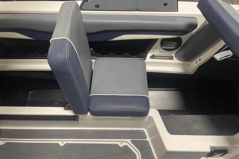 Slide: The Image of 2024 Axis T220 boat interior with blue and white seating, showcasing modern design. - 33
