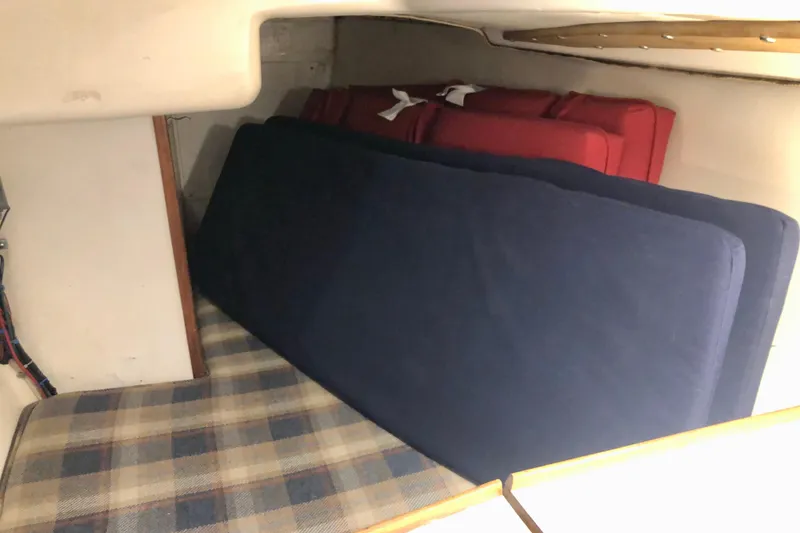 Slide: The Image of Interior cabin of 1972 C&C 35 MKI sailboat with cushions and plaid upholstery. - 14