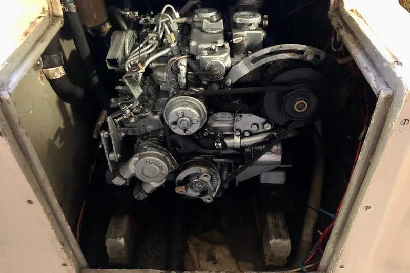 Slide: The Image of Engine compartment of a 1972 C&C 35 MKI sailboat, showcasing mechanical components. - 15