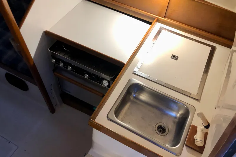 Slide: The Image of 1972 C&C 35 MKI yacht galley with stove, sink, and countertop. - 6
