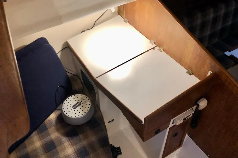 Slide: The Image of Interior of a 1972 C&C 35 MKI sailboat with a compact navigation station. - 8