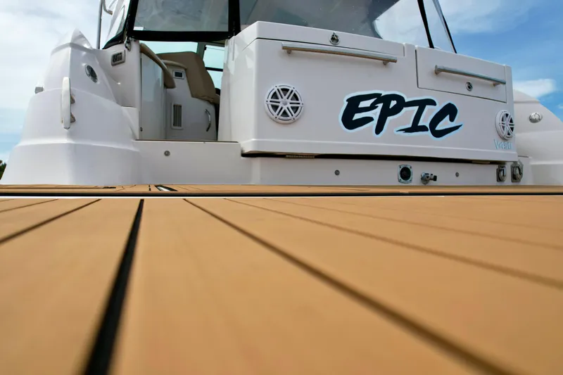 Slide: The Image of 2009 Four Winns V458 yacht with teak deck and "EPIC" name on the stern. - 12