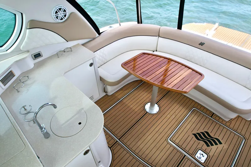 Slide: The Image of Luxurious 2009 Four Winns V458 yacht interior with elegant seating and wooden table. - 18