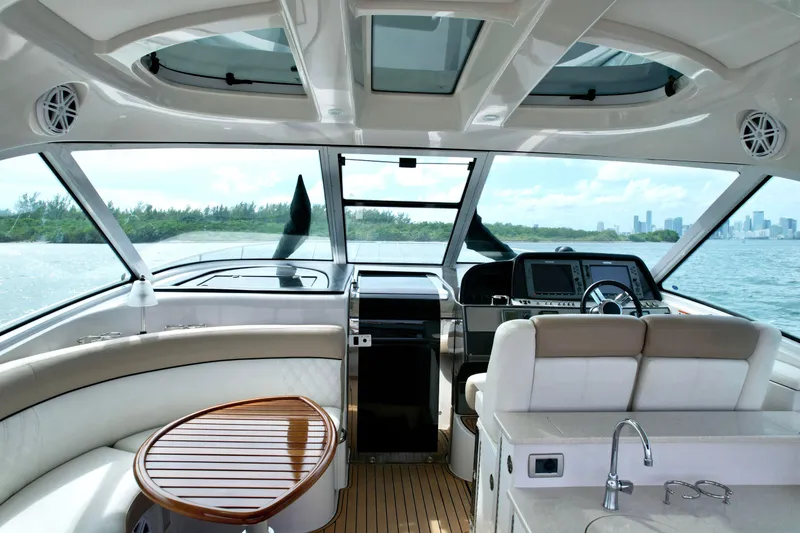 Slide: The Image of Interior view of 2009 Four Winns V458 yacht with luxurious seating and modern dashboard. - 19