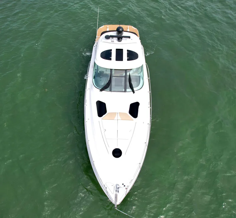 Slide: The Image of 2009 Four Winns V458 yacht on open water, aerial view. - 2