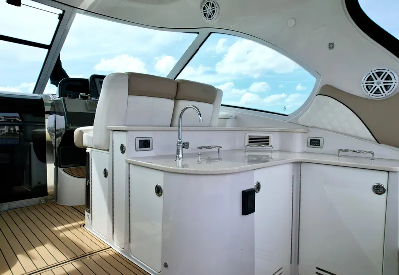 Slide: The Image of Luxurious interior of 2009 Four Winns V458 yacht with modern kitchenette and seating. - 20