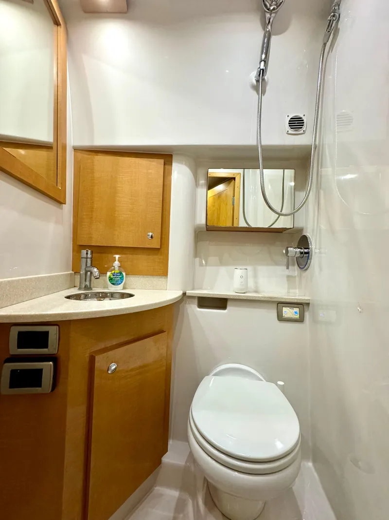 Slide: The Image of 2009 Four Winns V458 yacht bathroom with shower, sink, and toilet. - 26