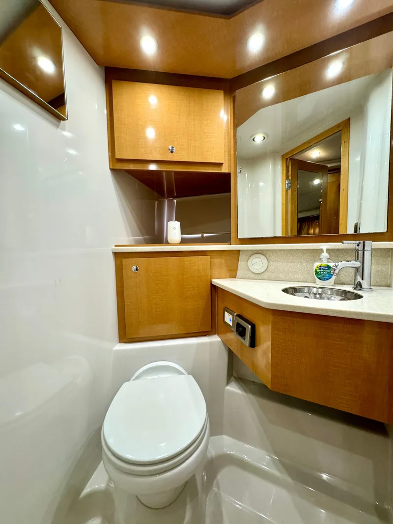 Slide: The Image of Luxurious 2009 Four Winns V458 yacht bathroom with modern fixtures and wooden cabinetry. - 30