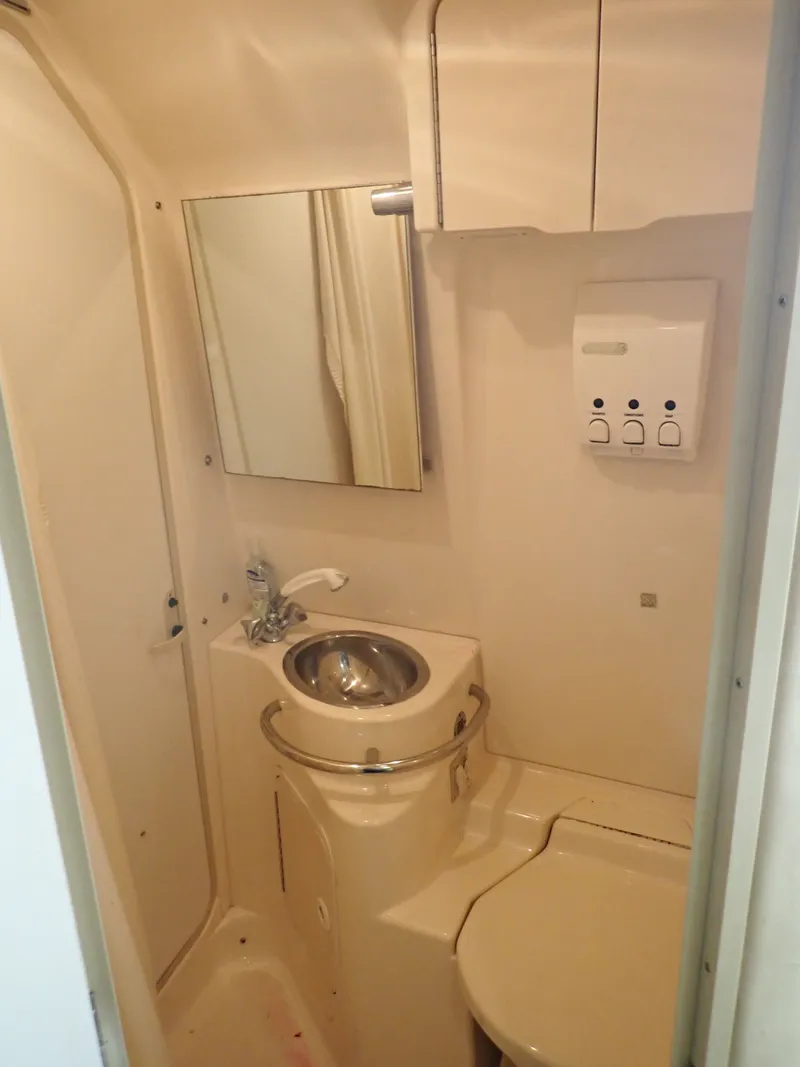 Slide: The Image of Compact bathroom in a 1998 Sea Ray Sundancer yacht. - 11