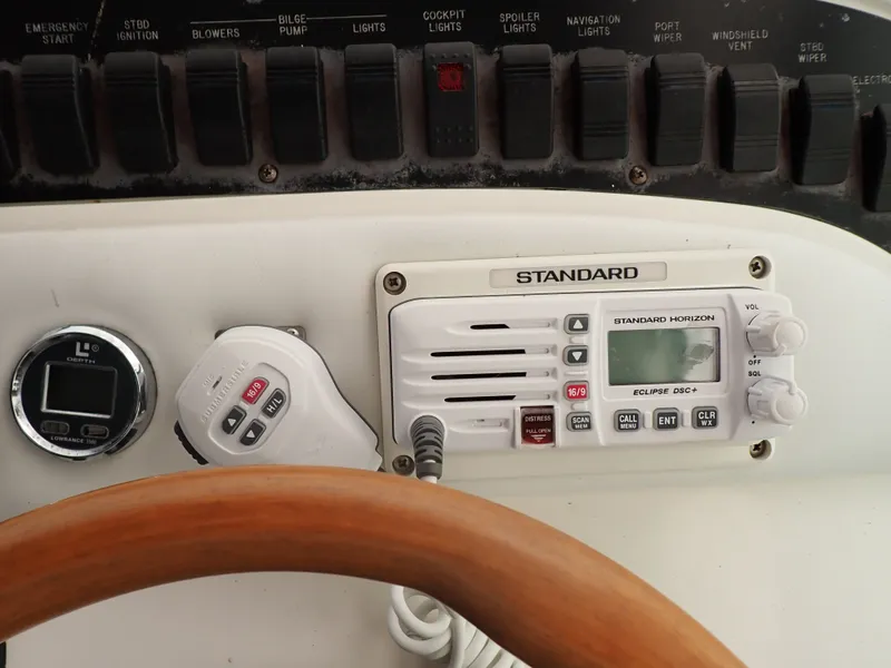 Slide: The Image of Dashboard of a 1998 Sea Ray Sundancer boat with radio equipment. - 6