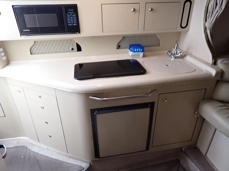 Slide: The Image of Galley kitchen in a 1998 Sea Ray Sundancer yacht. - 8
