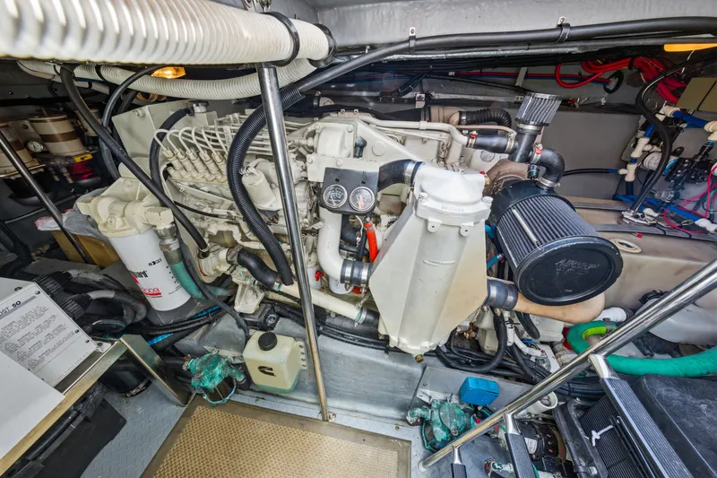Slide: The Image of Engine room of 2002 Sea Ray 460 Sundancer, showcasing detailed mechanical components. - 43