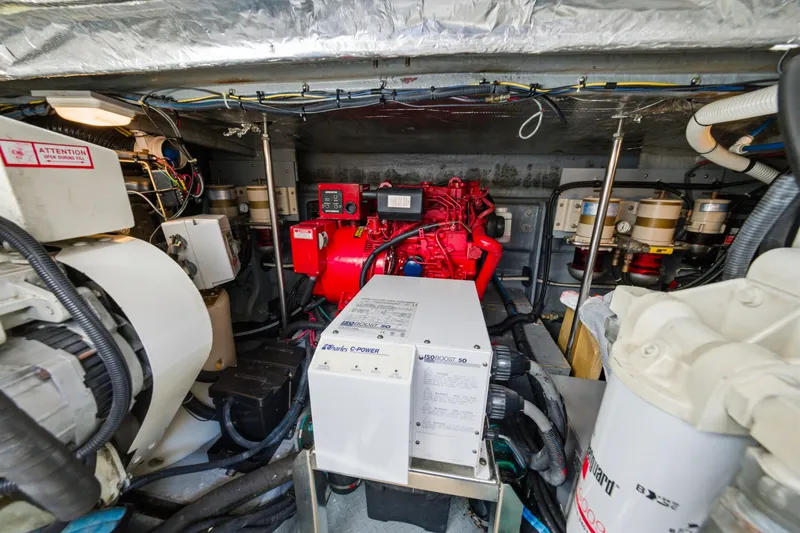 Slide: The Image of Engine room of a 2002 Sea Ray 460 Sundancer with visible machinery and components. - 44