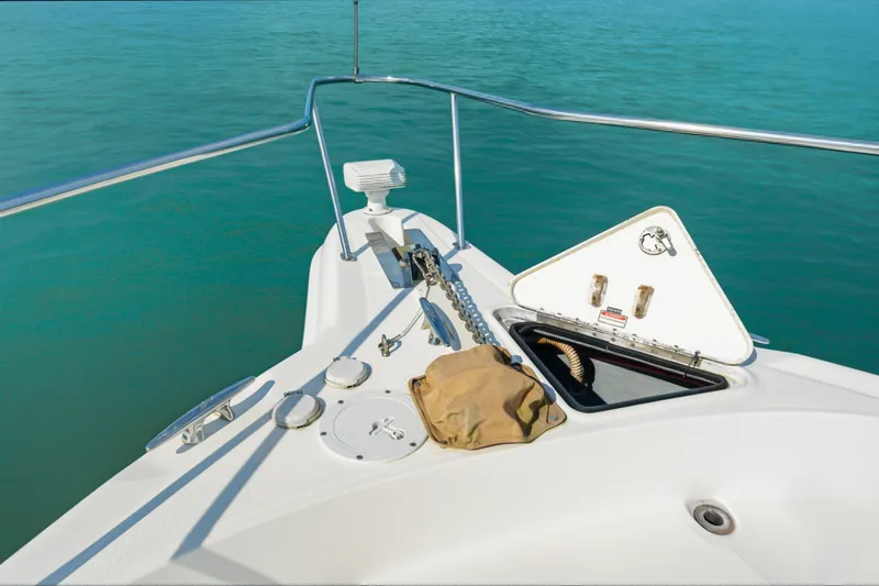 Slide: The Image of Bow of 2002 Sea Ray 460 Sundancer yacht with anchor and open hatch. - 6