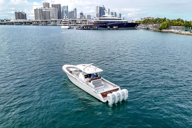 The Image of 2022 Valhalla Boatworks V-41 on water, side view with cityscape background. - 0
