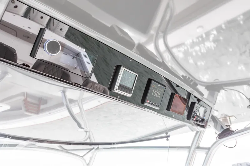 Slide: The Image of 2022 Valhalla Boatworks V-41 helm with modern controls and navigation display. - 13