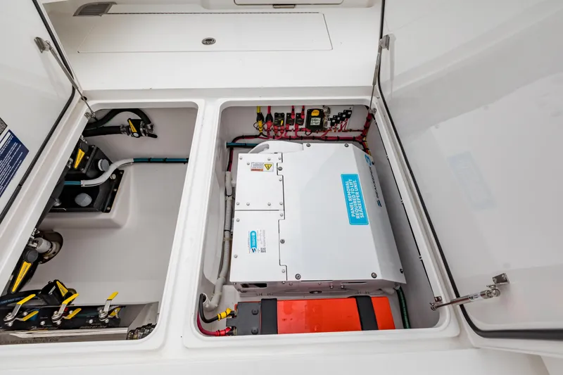 Slide: The Image of 2022 Valhalla Boatworks V-41 interior with open storage compartments and seating. - 22