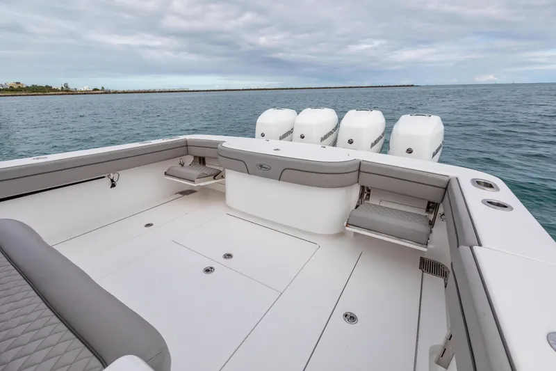 Slide: The Image of 2022 Valhalla Boatworks V-41 luxury interior with elegant seating, cruising near waterfront buildings. - 29