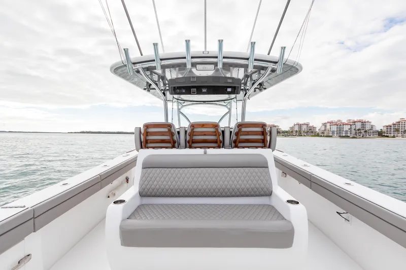 Slide: The Image of 2022 Valhalla Boatworks V-41 bow seating area with table on calm water. - 31