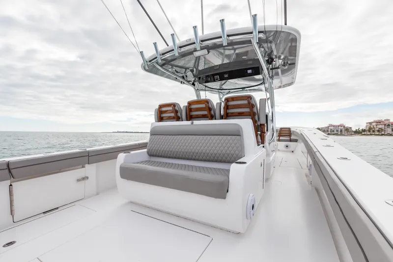 Slide: The Image of 2022 Valhalla Boatworks V-41 cruising in a scenic harbor setting. - 35