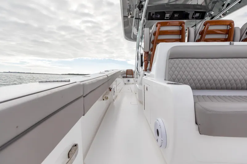 Slide: The Image of 2022 Valhalla Boatworks V-41 cruising near city skyline and large cruise ship. - 36