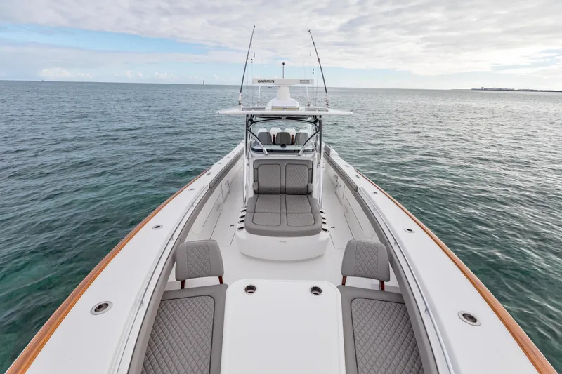 Slide: The Image of 2022 Valhalla Boatworks V-41 cruising near modern waterfront cityscape. - 39