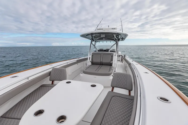 Slide: The Image of 2022 Valhalla Boatworks V-41 cruising on blue water with city skyline backdrop. - 41