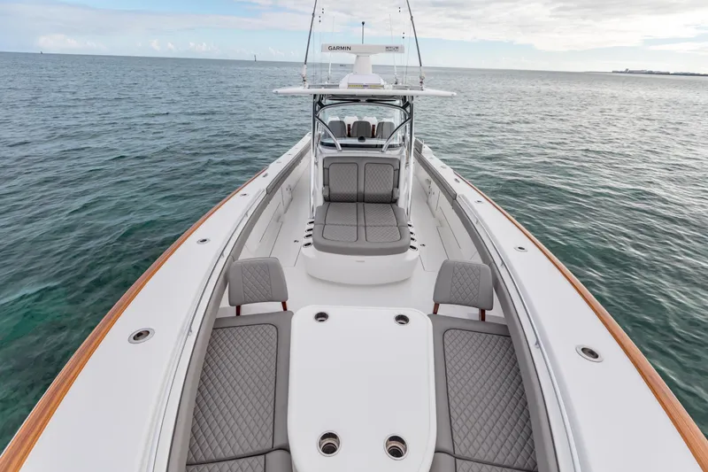 Slide: The Image of 2022 Valhalla Boatworks V-41 cruising on a scenic waterfront with city skyline. - 42