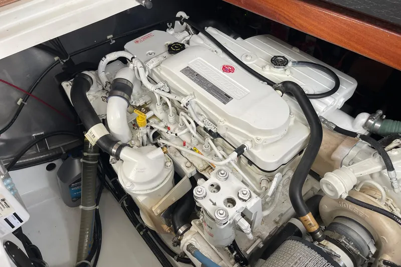 Slide: The Image of Engine compartment of a 2018 Beneteau Swift Trawler 35, showcasing detailed mechanical components. - 100
