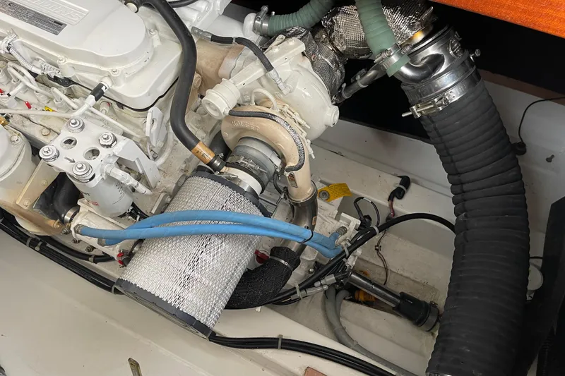 Slide: The Image of Engine compartment of a 2018 Beneteau Swift Trawler 35, showcasing detailed mechanical components. - 101