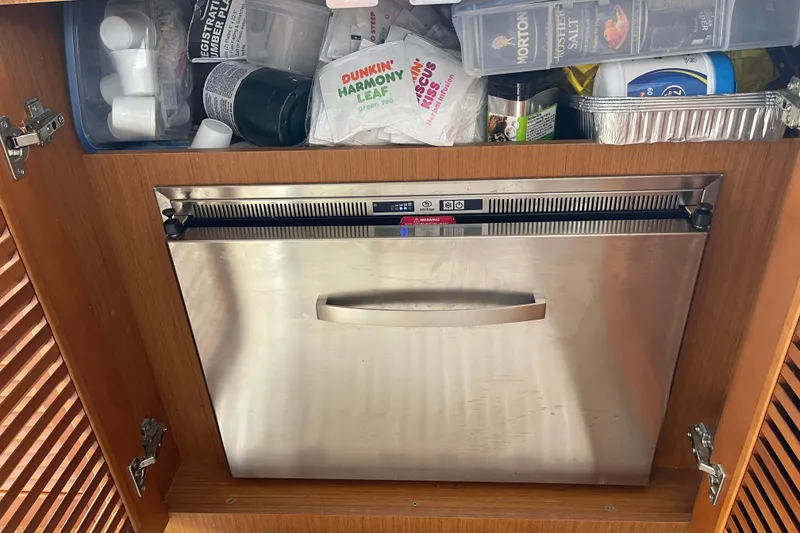 Slide: The Image of Stainless steel dishwasher in a 2018 Beneteau Swift Trawler 35 kitchen cabinet. - 41