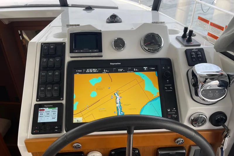 Slide: The Image of Beneteau Swift Trawler 35 helm with navigation display and control panel, 2018 model. - 52