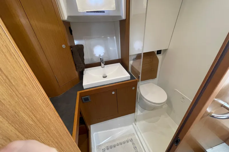 Slide: The Image of Bathroom interior of 2018 Beneteau Swift Trawler 35, featuring sink and toilet. - 68