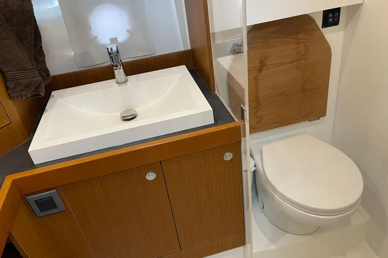 Slide: The Image of 2018 Beneteau Swift Trawler 35 bathroom with modern sink and toilet. - 71