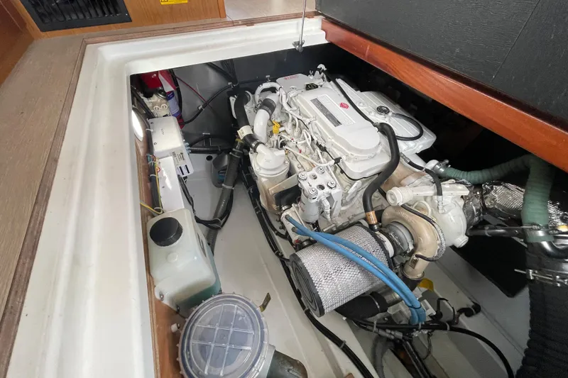 Slide: The Image of Engine compartment of 2018 Beneteau Swift Trawler 35, showcasing mechanical components. - 99