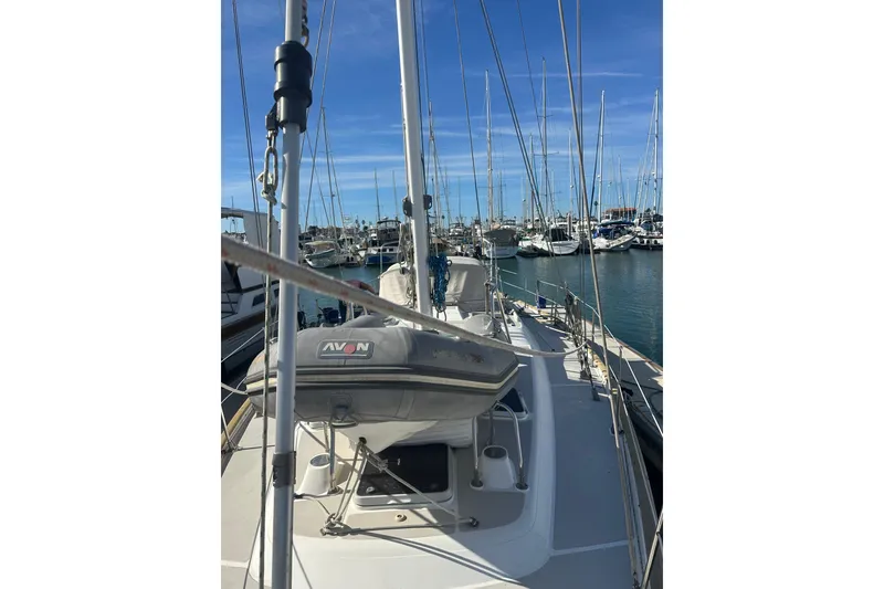 Slide: The Image of Sailboat deck view of 1991 Taswell Sloop in marina, clear blue sky. - 26