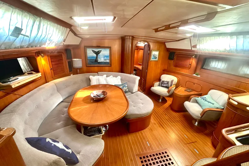 Slide: The Image of Luxurious 1991 Taswell Sloop interior with elegant wood finish and cozy seating area. - 3