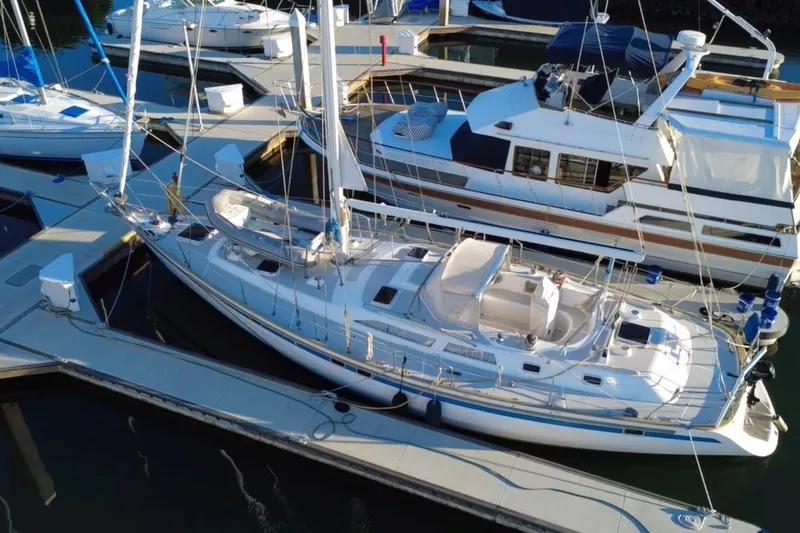 Slide: The Image of Aerial view of a 1991 Taswell Sloop docked at a marina. - 34